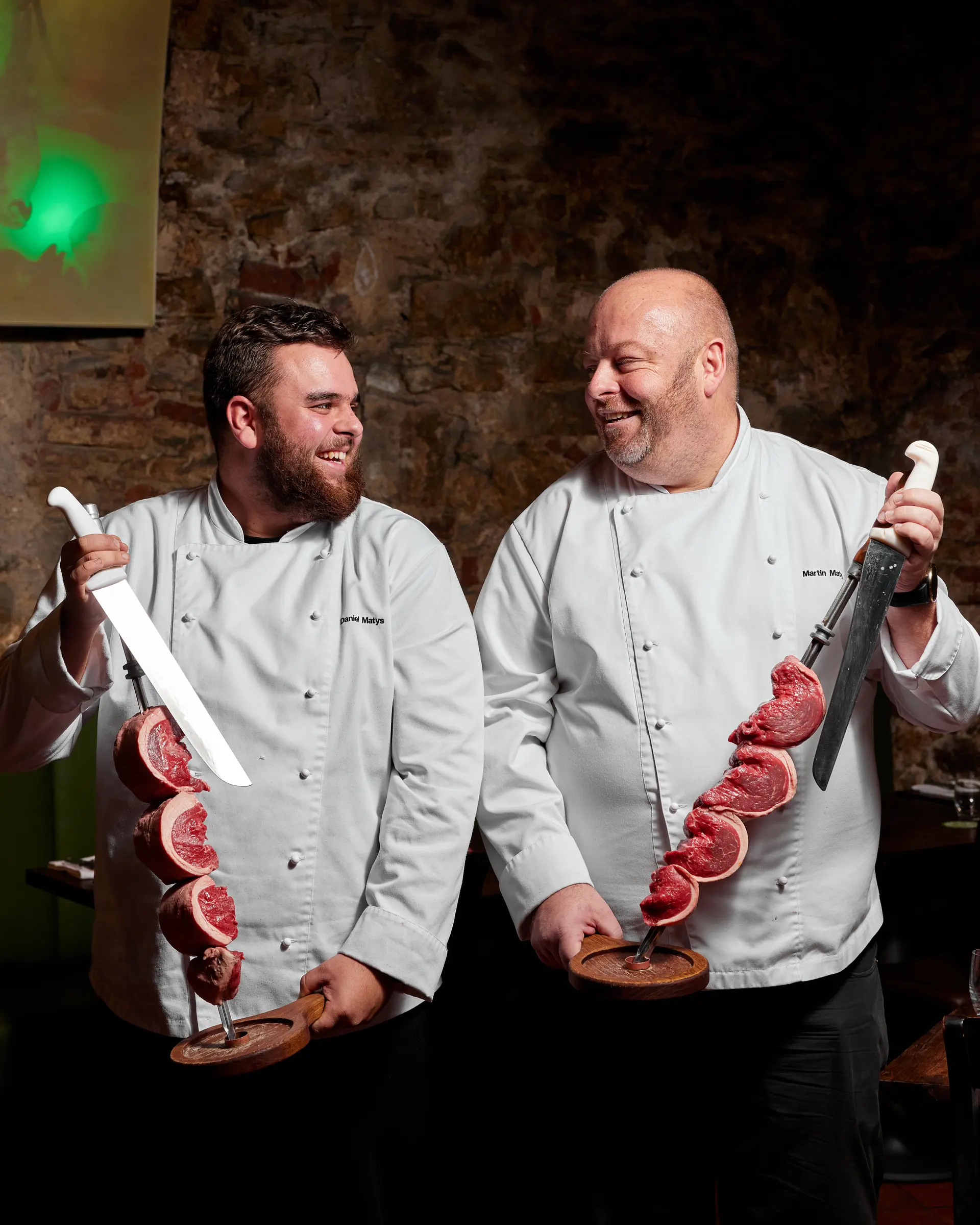 Passadores de carne serving grilled meat on skewers at Brasileiro restaurant.